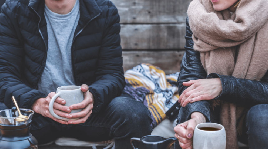 a couple having coffee together on a winter afternoon