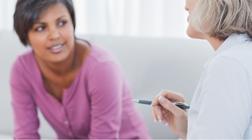A woman listening carefully while her therapist talking